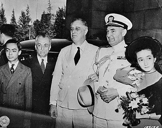 Press photograph of President Manuel Quezon (second from left) and President Franklin Roosevelt around the time of the ceremony transferring Naval Vessel Bataan to the Coast Guard. (Courtesy of the Franklin D. Roosevelt Presidential Library and Museum) Press photograph of President Manuel Quezon (second from left) and President Franklin Roosevelt around the time of the ceremony transferring Naval Vessel Bataan to the Coast Guard. (Courtesy of the Franklin D. Roosevelt Presidential Library and Museum)